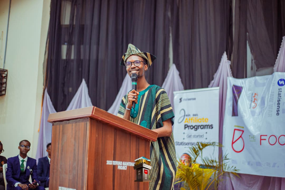 Foundation director at an outdoor community gathering and civic programme