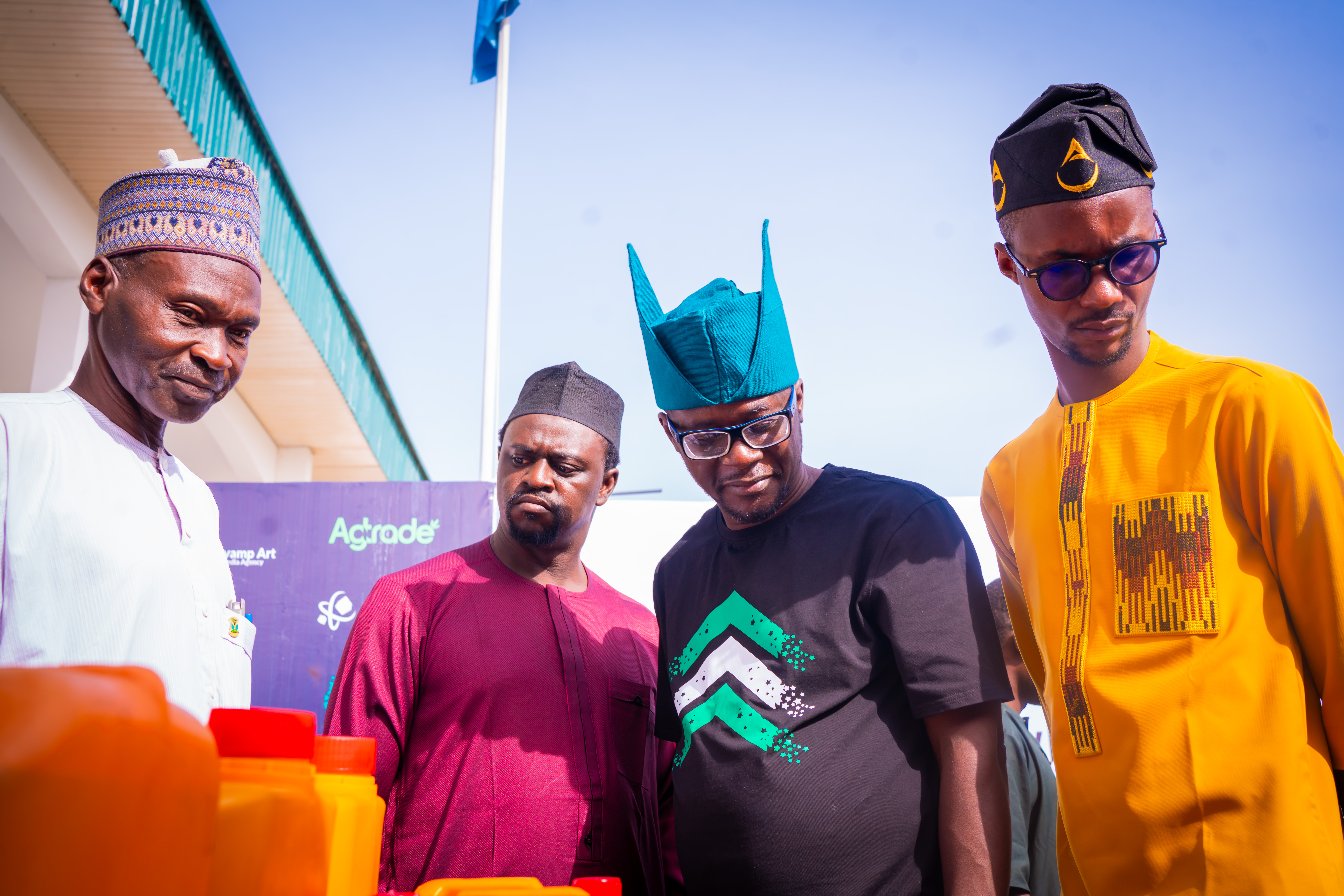 Foundation stakeholders examining a community healthcare resource kit at a field activation